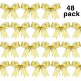 fiocchi dorati per rendere il tuo albero ancora più elegante